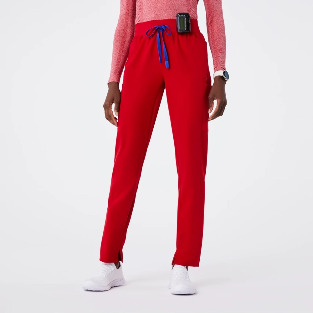 FIGS Women’s High Waisted Scrub Pant in color Winning Red